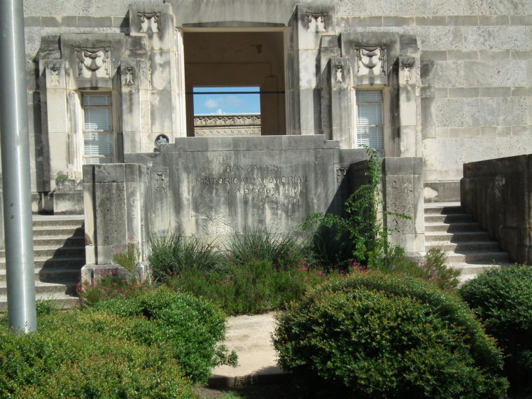 The front of the Gonzales Memorial Museum shows three-quarters of a century of stains from the elements, making the cream-colored building almost black in places.