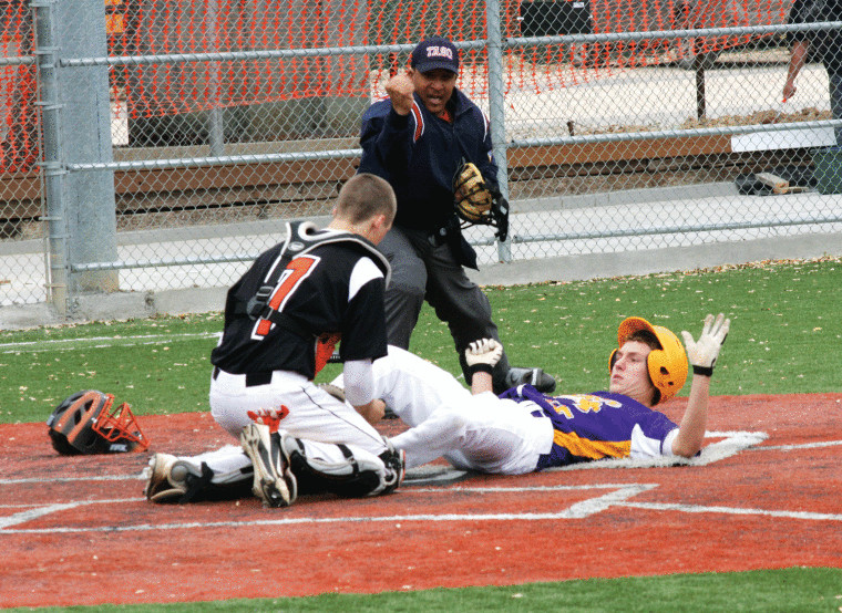 Gonzales catcher Devin Benes tags out Laddie Patek of Shiner, but the Apaches came up short, 3-2.