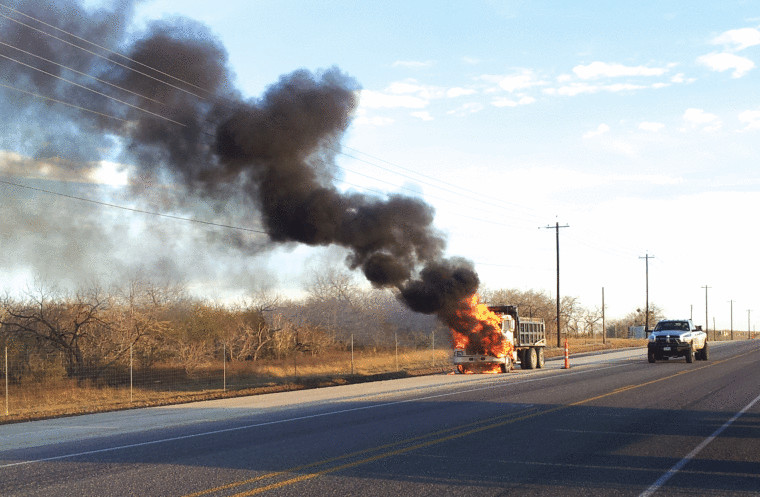 A dump truck is fully engulfed in flames shortly after 5:30 p.m. Thursday on U.S. Highway 183 about 10 miles south of Gonzales. Firefighters from Gonzales battled the blaze, which snarled traffic in the area. No one was reported injured in the fire.
