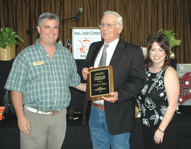Frank Michael Benes (center) was introduced Friday night at the Gonzales Chamber of Commerce and Agriculture annual membership banquet as the recipient of the David B. Walshak Lifetime Achievement Award. Presenting Benes the award are outgoing chamber president Patrick Hodges (left) and incoming chamber president Sascha Kardosz.