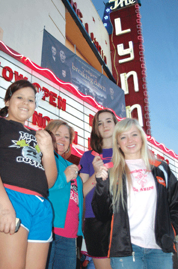 From left, Sarah Andrews, Dinah Braune, Maddie Condel and Kiley Braune had tickets in hand and were among the first in line for “Breaking Dawn Part 2” when the movie re-opened the historic Lynn Theatre in downtown Gonzales.