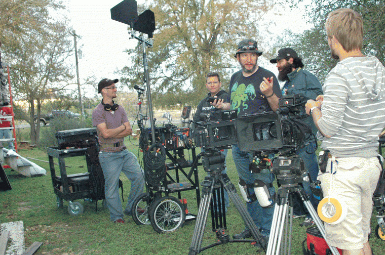 The crew sets up cameras for the filming of "Red on Yella, Kill a Fella" at the Pioneer Village Living History Center in Gonzales, Texas.
