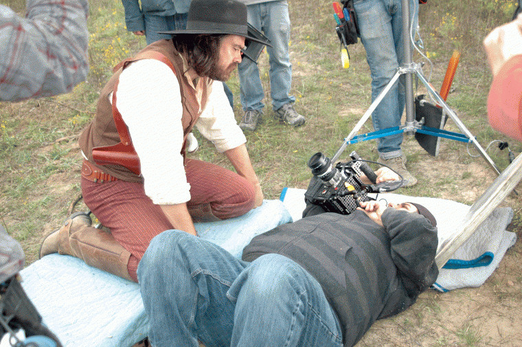 Justin Meeks looks into the camera for a closeup during shooting of "Red on Yella, Kill a Fella" while on location at the Meeks Ranch northeast of Gonzales, Texas.