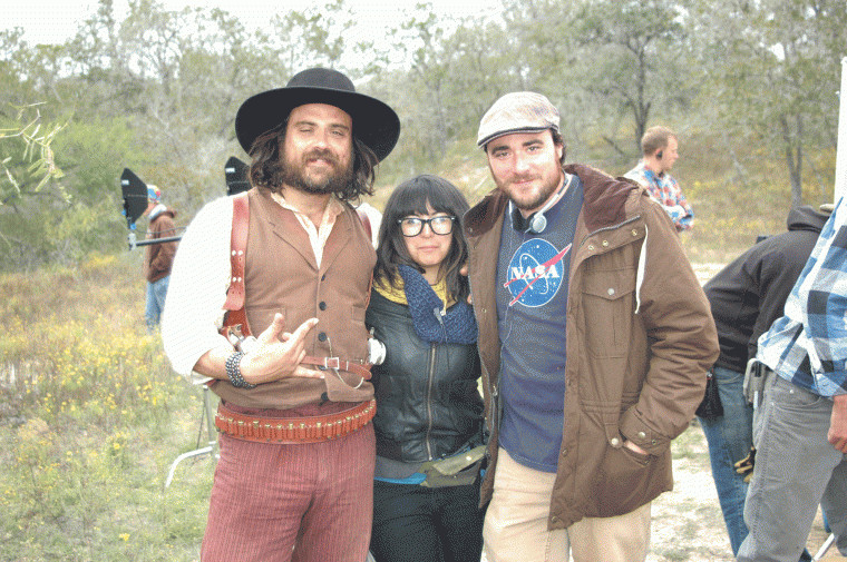 From left, co-director Justin Meeks, assistant director Michelle Millette and co-director Duane Graves pause during the filming of "Red on Yella, Kill a Fella" while on location at the Meeks Ranch northeast of Gonzales, Texas.