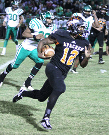 Gonzales tailback Cecil Johnson (12) eclipsed the 2,000-yard mark on the season with his 163-yard performance in the Apaches’ 16-14 loss to Smithville Friday. Johnson finished the year with 2,016 yards and 25 touchdowns. He had 3,717 yards and 39 touchdowns over the last two seasons.