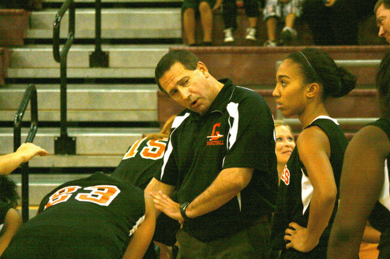 Gonzales girls basketball coach Kent Smith gives instructions to Lady Apache point guard Kelsey Hardy, right, during Gonzales’ 57-52 loss to Lockhart Monday in Lockhart. Smith came to Gonzales from Kemp, where he coached the Lady Jackets for four seasons.