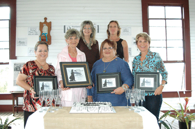Pioneering Women’s Day held Saturday at Pioneer Village Living History Center was climaxed with the naming of the Gonzales County Pioneering Woman for 2012 — Marjorie Burnett (second from left). Joining Burnett at the first-ever event were finalists (from left) Dr. Cathy Booth, Lillian Fernandez and Sherry Poe. Finalist Suzane Sexton was unable to attend the event. The recognition event which saluted modern-day women pioneers, was sponsored by The Gonzales Inquirer and Pioneer Village, which are operated by (back) Brenda Adams and Cindy Munson, respectively.