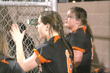 Shayla Simper (6) and Sibil Philippus cheer on their teamates during the bottom of the fourth inning in the Gonzales softball team’s 7-6 win over Yoakum Monday in Gonzales. Philippus and Simper both went 2-for-3 during the game.