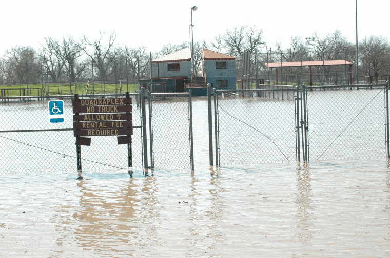 The baseball facilities at the Quadraplex in Independence Park
were inundated when the Guadalupe River exceeded its 31-foot flood
stage.