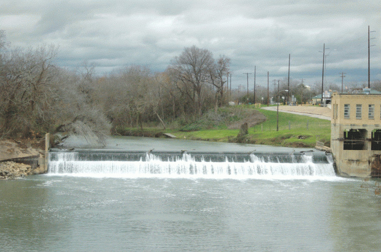 Water was rushing over the spillway at the old power plant at 4
p.m. Wednesday. The Guadalupe River is expected to swallow up the
spillway by late Thursday.