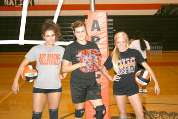 Gonzales volleyball players Morgan Simper, left, Danyelle Glass
and Kiley Braune not only play for the Lady Apaches varsity
volleyball team, they also happen to be varsity cheerleaders.