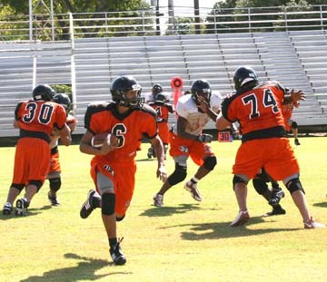 Gonzales running back Cory Espinosa (6) looks for room to run
upfield during the Gonzales football team’s Orange-Black intrasquad
scrimmage Saturday at Apache Stadium. Espinosa scored on the play
as he ran 77 yards into the endzone. The Apaches visit Blanco for
their first preseason scrimmage at 11 a.m. Saturday at Panther
Field in Blanco.