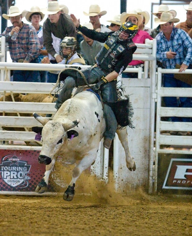 Kody Lostroh holds on tight for his eight-second ride on the
bull Zumba in the long go Saturday. Lostroh earned just 78 points
for the ride but came away with the event’s top prize after staying
on for another ride in the short go.
