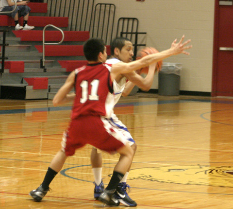 Guard Cory Fonseca looks for room to maneuver against San Perlita guard Oscar Pena. Fonseca finished with 12 points, four rebounds and one assist in Waelder’s regional quarterfinal win.