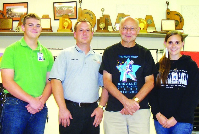 Gonzales High School Band Director Dennis Boucher (2nd from left) enlisted the help of celebrated musician Peter Lengyel (2nd from right) to create this year’s contest show. Lengyel has worked with over 280 high school bands in 23 different states. Also pictured are Apache Band Drum Majors Jordan Holmes (far left) and Mary Liz Menking.