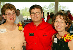 Special guests -- Guadalupe Valley Electric Cooperative General Manager Marcus W. Pridgeon (center) visits with Sharon Carley (left) and Karen Ploetz (right) at the dedication of GVEC's Thomas A. Coor Lineman Training Facility in Gonzales. Carley and Ploetz are daughters of Coor who served GVEC for many years as line superintendent in Seguin. (Submitted photo)