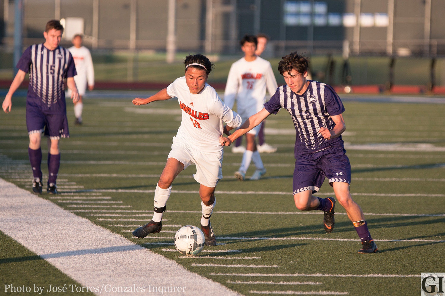 Daniel Cruz (10) gets tugged by a Boerne defender in Gonzales' 3-1 loss against the Greyhounds in the bi-district round.