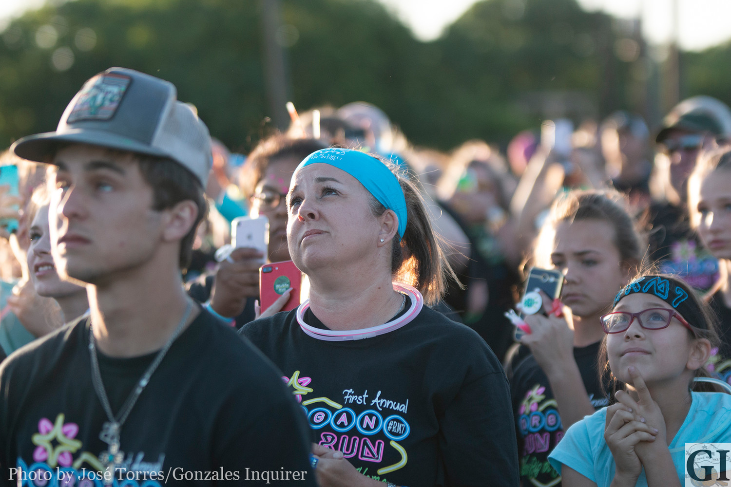 Sarah Farrar, mother of the late Morgan Farrar, looks up at the turquoise balloons released to the sky in honor of Morgan last Saturday at Independence Park.