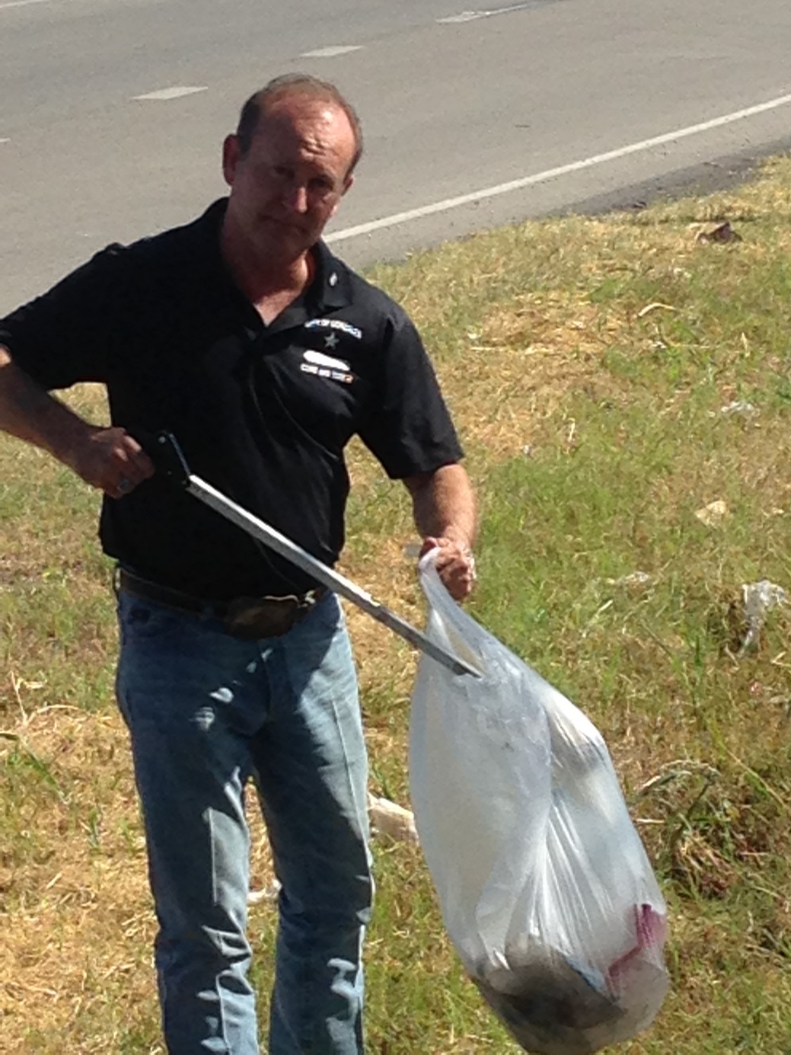 Gonzales City Tourism Director Clint Hille helped clean up trash along the highway near J.B. Wells over the weekend.