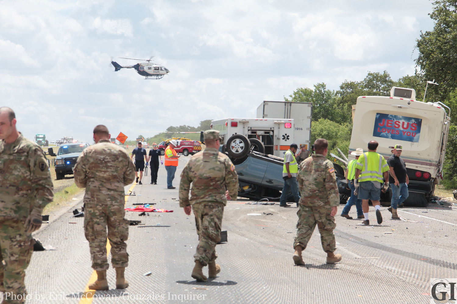Members of the Texas National Guard's 442nd Engineering Company from Angleton are seen assisting at the scene of a major crash last week on I10 that took the lives of two occupants of an RV. The soldiers were headed home from a weekend of training and were the first on scene to render aid and support to the victims.