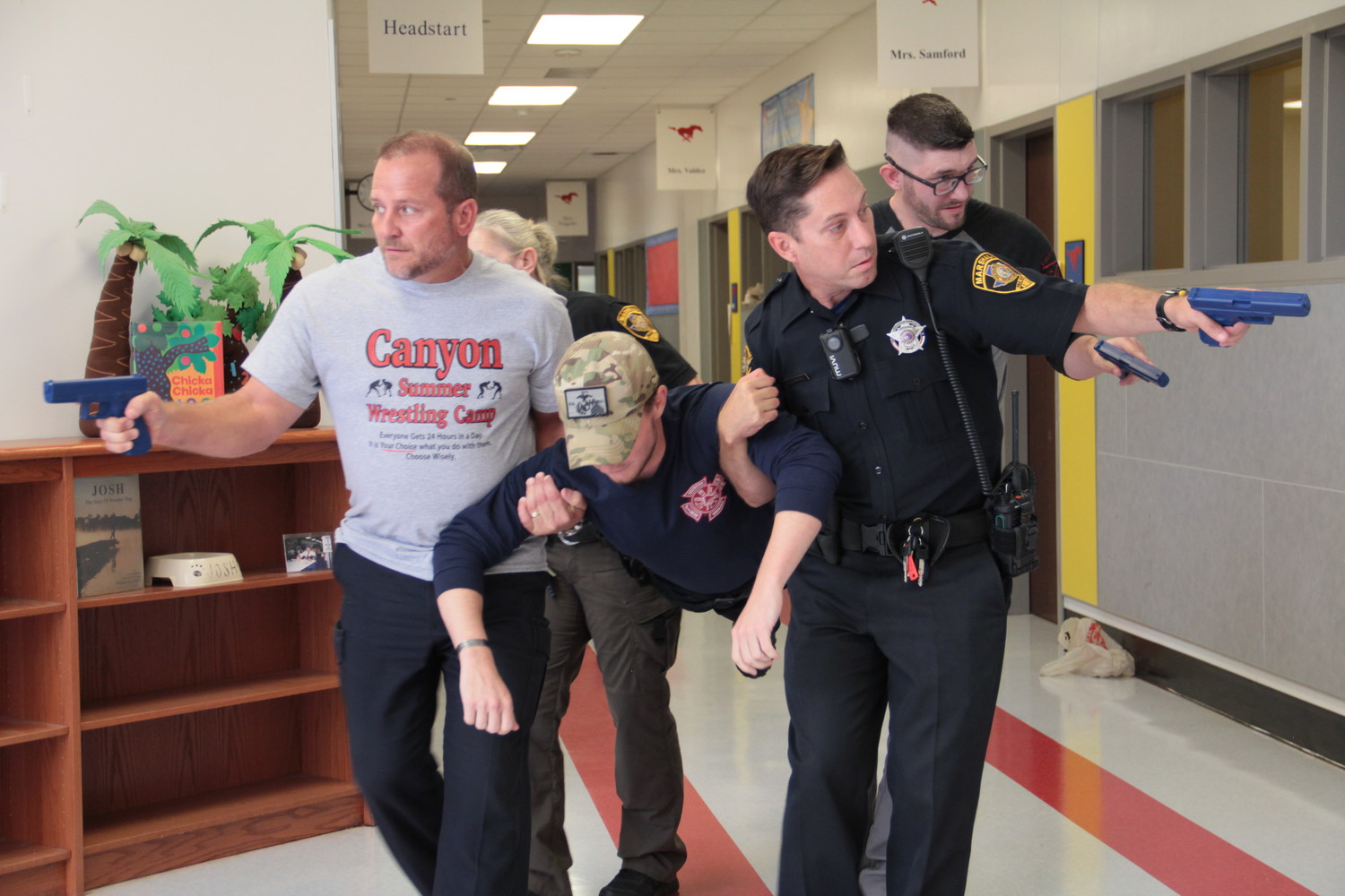 Students in the ALERRT active shooter class at Smiley Elementary practiced retrieving a victim of a shooting while providing cover as they took the person to safety. The two-day class trained law officers on scenarios should an event like Sandy Hook or Santa Fe happen here.
