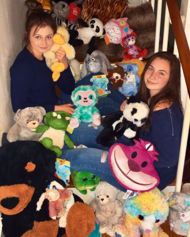 Gonzales High School students Kora, left, and Sophia Kolle have a lot of visitors at home in the form of various stuffed animals. The cuddly creatures will only be crashing at the sisters' casa for a short while, for they are destined to be donated to orphans and elderly residents in the area soon.