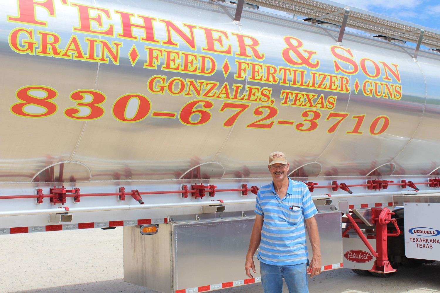 Jimmy Fehner stands proudly in front of the new Fehner and Son 18 wheeler that made its maiden delivery on Monday.