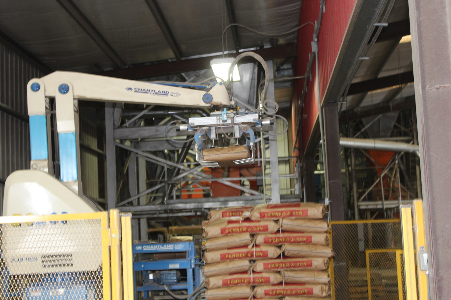 In 2007, this robot started the automation process at Fehner. The robot stacks feed bags, and then 8 different fork trucks load the pallets and store them around the property