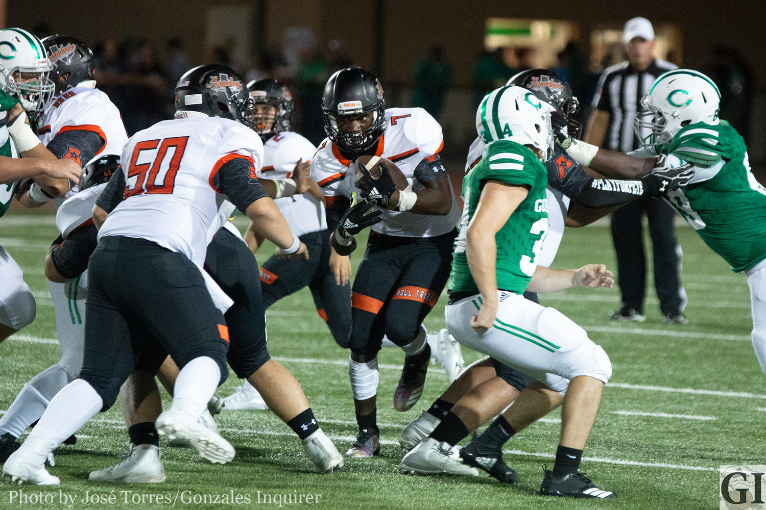 Elijah Holiday (7) tries to find a hole in Gonzales' 48-15 loss against Cuero at Gobbler Stadium.