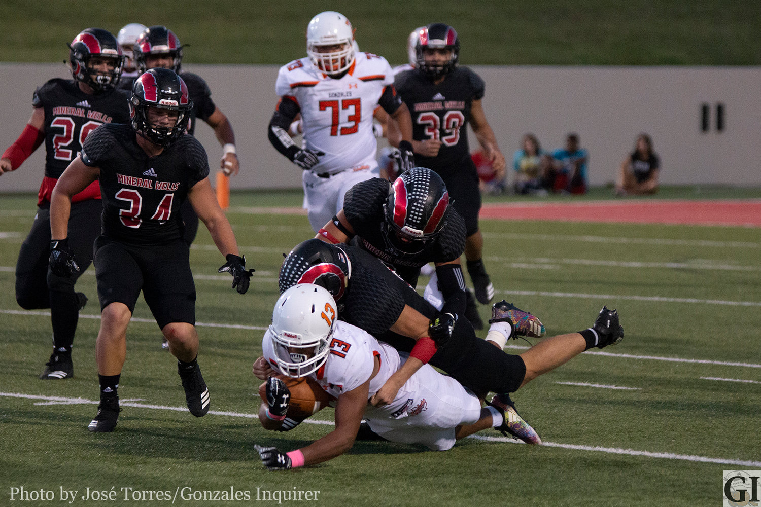 James Martinez (13) gets tackled in the open field in Gonzales' 38-21 loss against Mineral Wells