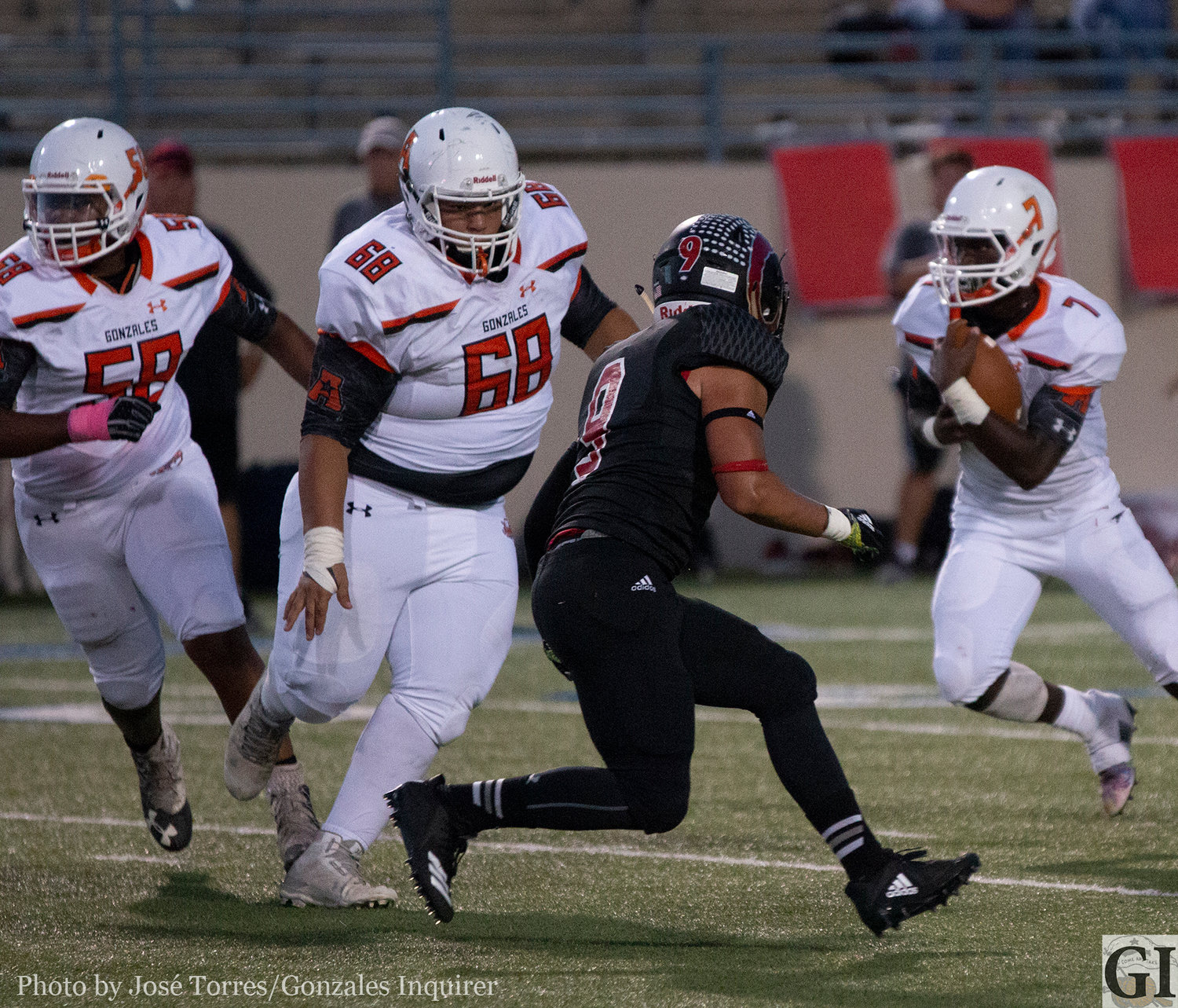 The Apaches offense will lean on its line for success against Pleasanton this Friday. Pictured are offensive linemen Desmond Bolden (58) and Larry Gomez (68) creating running lanes for Elijah Holiday (7).