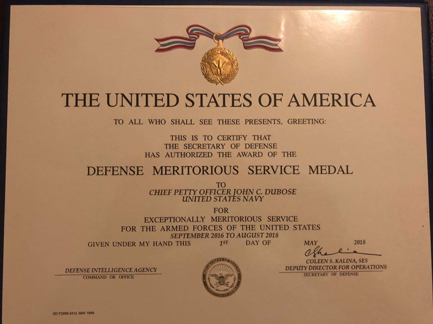 The citation reads in part: “This is to certify that the Secretary of Defense has authorized the award of the Defense Meritorious Service Medal to Chief Petty Officer John C. DuBose, United States Navy, for Exceptionally Meritorious Service for the Armed Forces of the United States September 2016 to May 2018.”