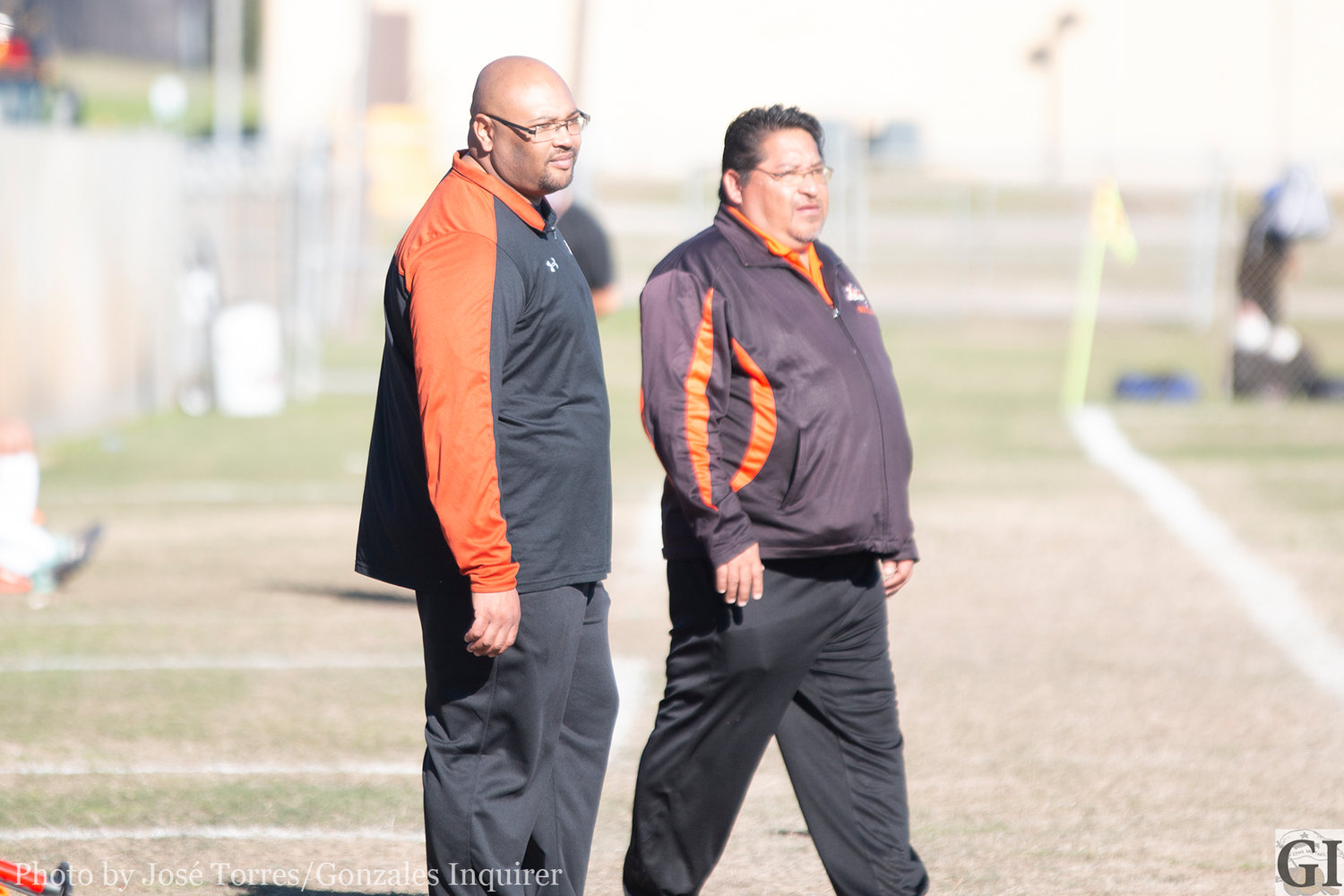 Newly hired coach Anthony Slade (left) looks on with head boys soccer coach Greg Ramirez (right) during Gonzales’ inaugural tournament last weekend. Friday was Slade’s first day on the job.
