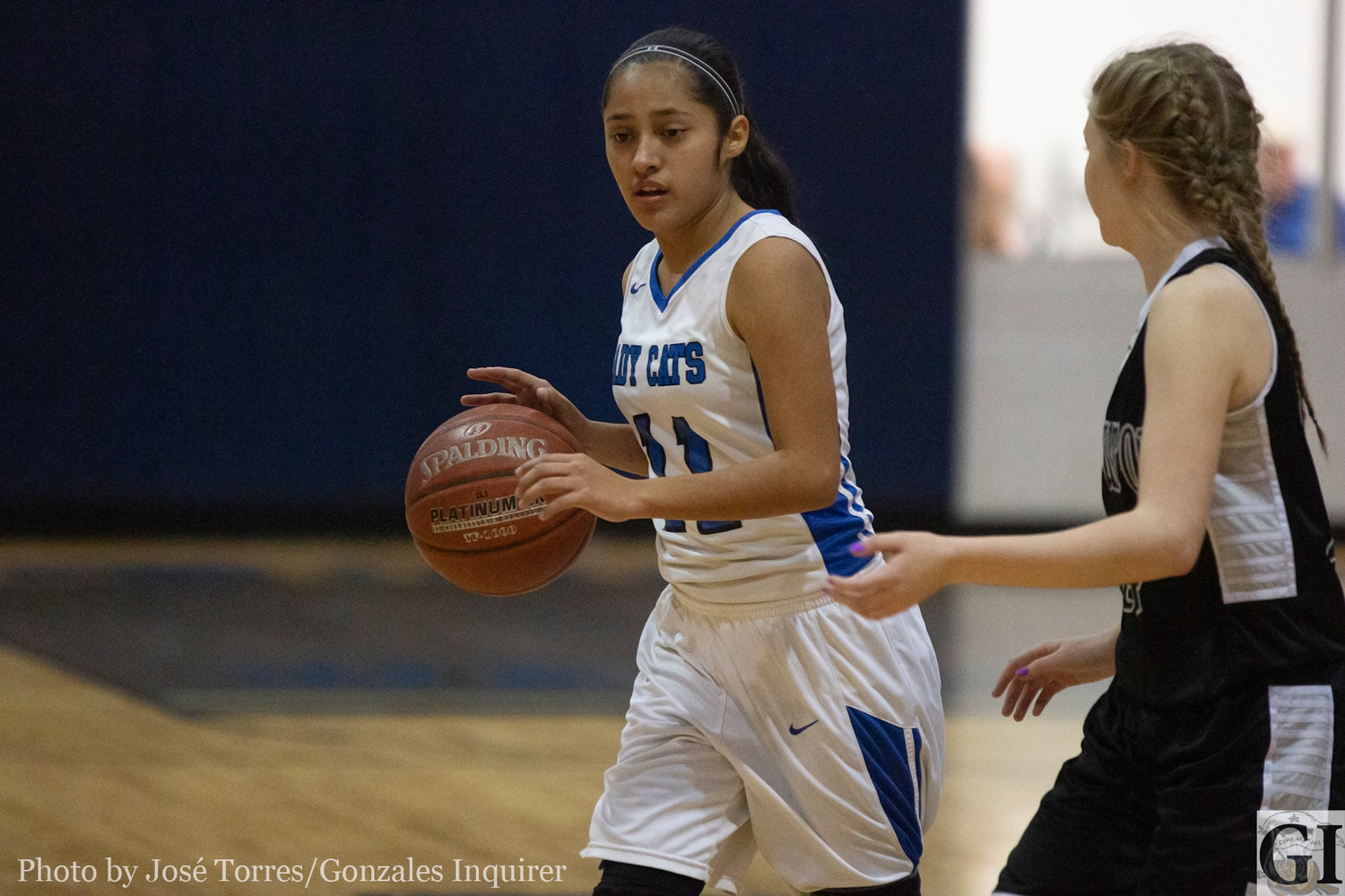 Fatima Torres (11) dribbles through a defender in Tuesday’s 54-11 to #11 Moulton. Torres finished with two points, both from the free-throw line.