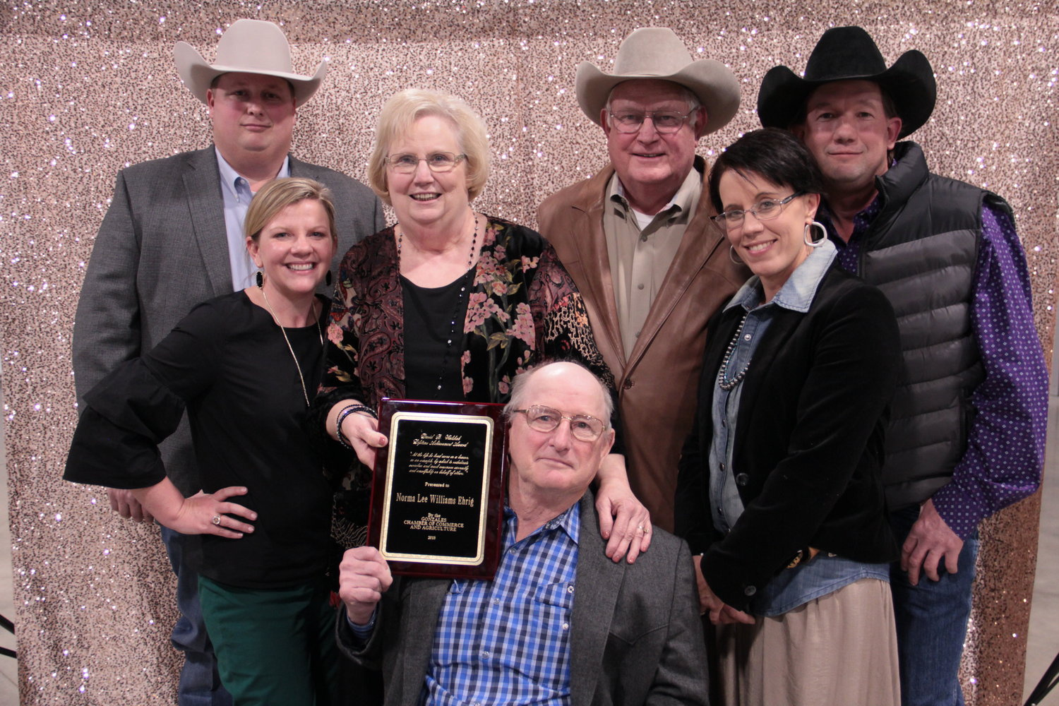 Norma Ehrig is surrounded by her family as she accepts the David B. Walshak Lifetime Achievement Award at the recent Gonzales Chamber of Commerce banquet.