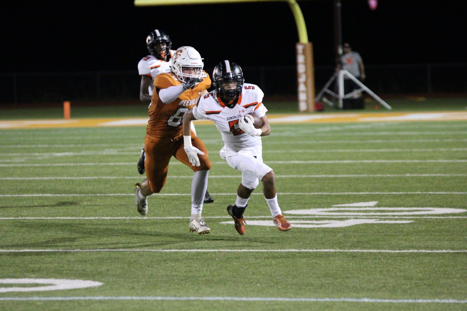 Adrian Rodriguez (5) returns an interception in Gonzales' 27-3 loss against Beeville on Friday.