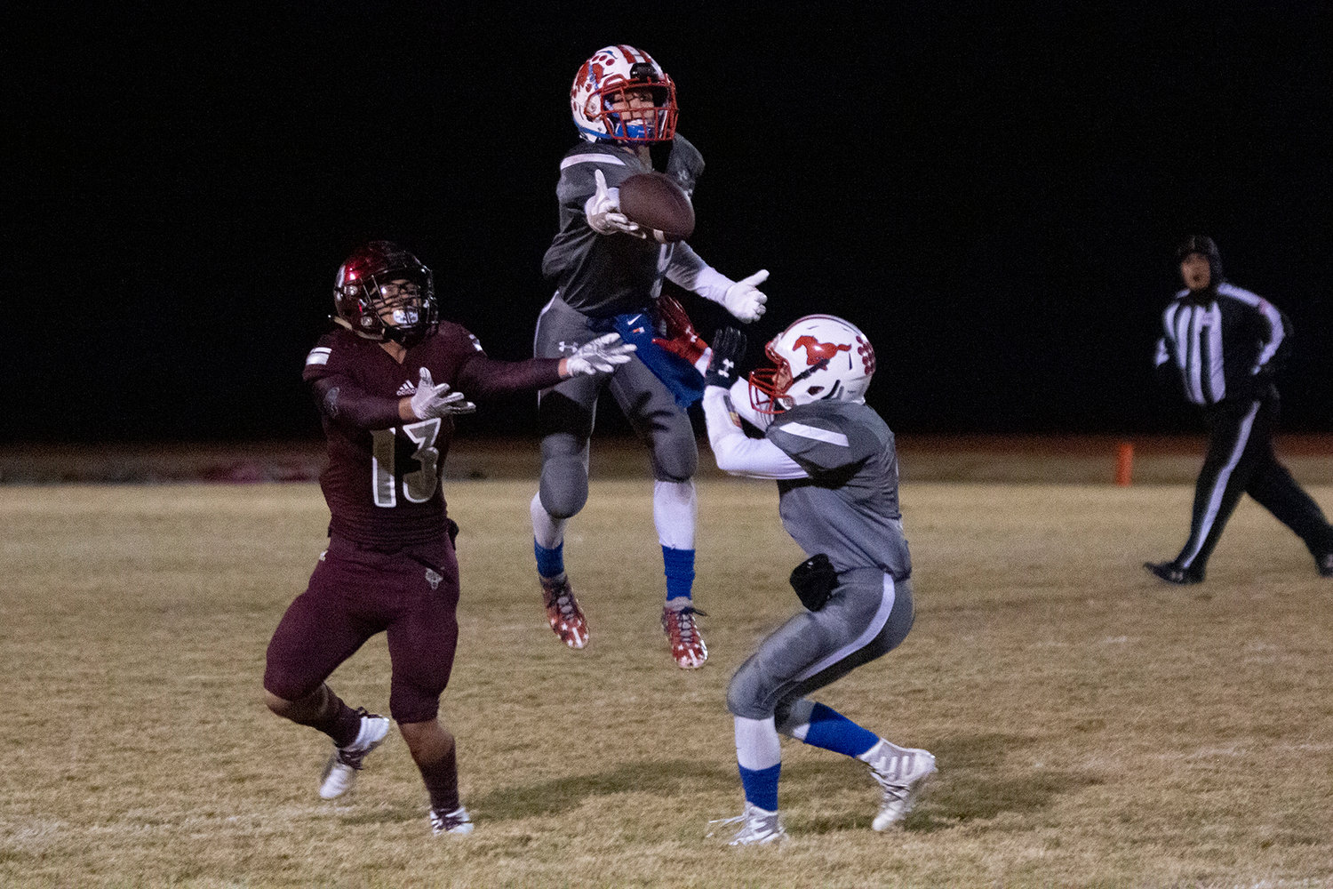 Chris Brown (9) jumps up and bats down a ball in Nixon-Smiley's 29-14 victory on Friday.