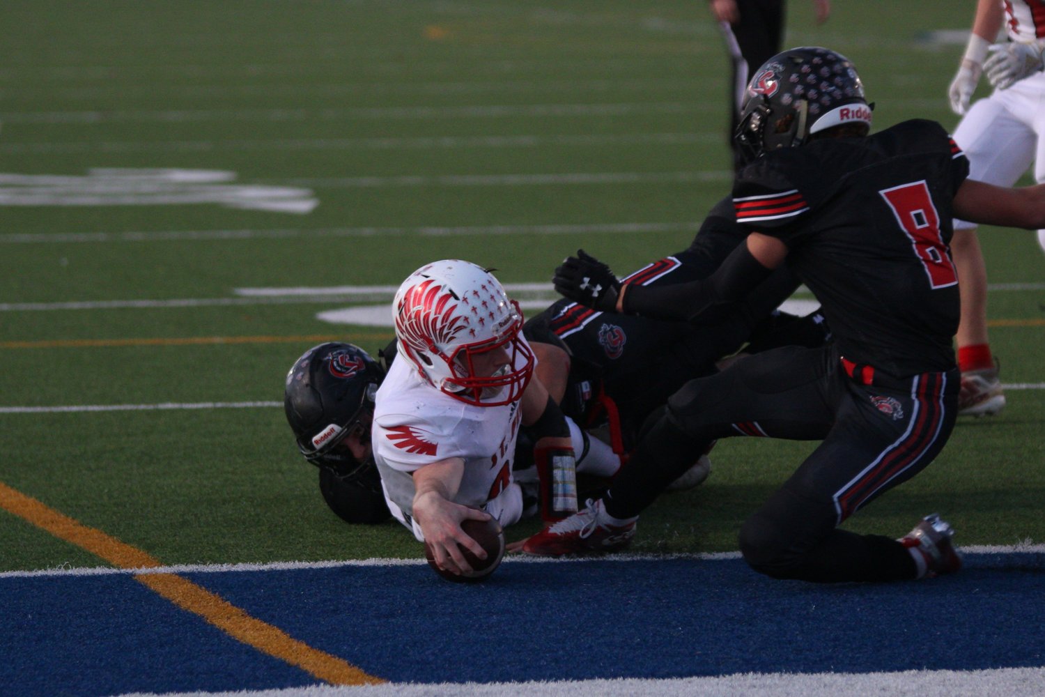 Carson Reese (22) gets the ball over the line in a three-yard touchdown rush.