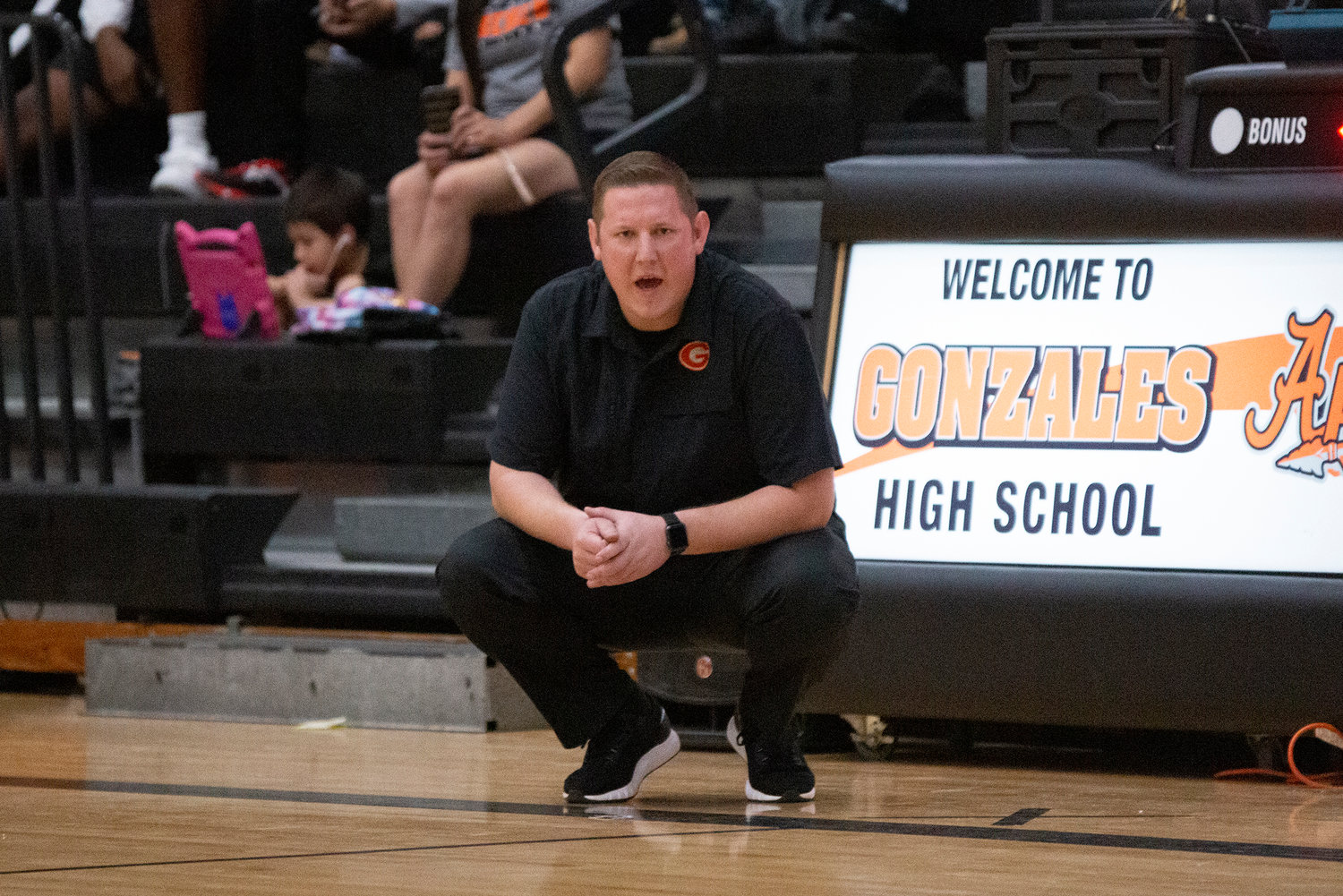 Gonzales head coach Alec Paramski shouts out instructions from the sidelines in their 61-41 victory over Bandera on Tuesday.