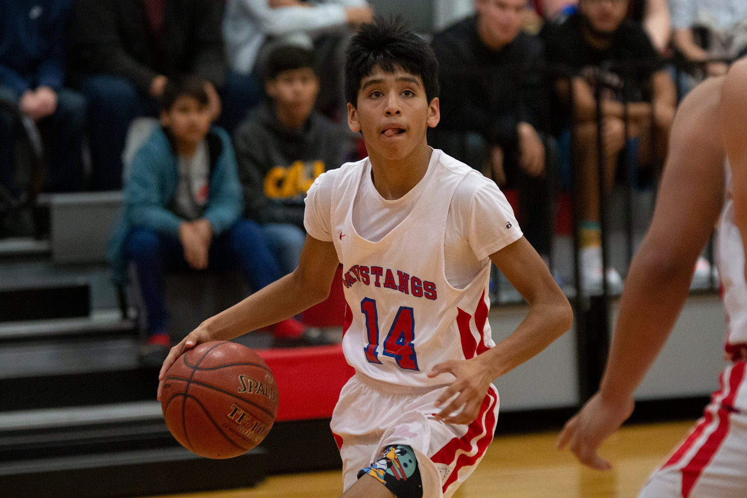 Brayden Martinez (14) looks to shoot in Nixon-Smiley’s 53-33 loss against Poth on Tuesday.