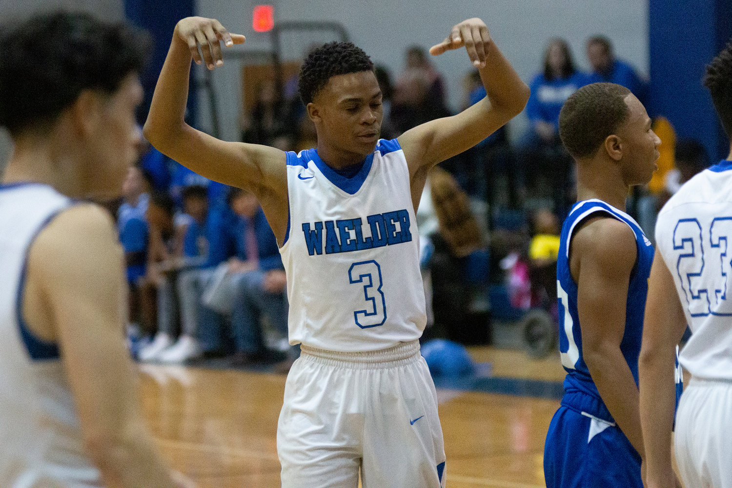 Jacovan Fields (13) celebrates after scoring in Waelder’s 72-57 victory over Dime Box last Friday. The homecoming king finished the game with 13 points.