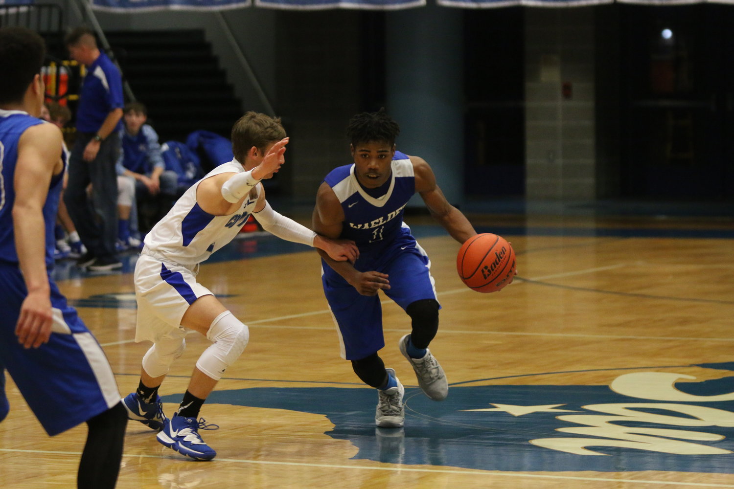 Isaiah Jones-Miller drives by a McMullen County defender in Waelder’s 66-52 victory on Tuesday. Jones-Miller finished the night with 16 points, tied for a team best with Colby Thorne.