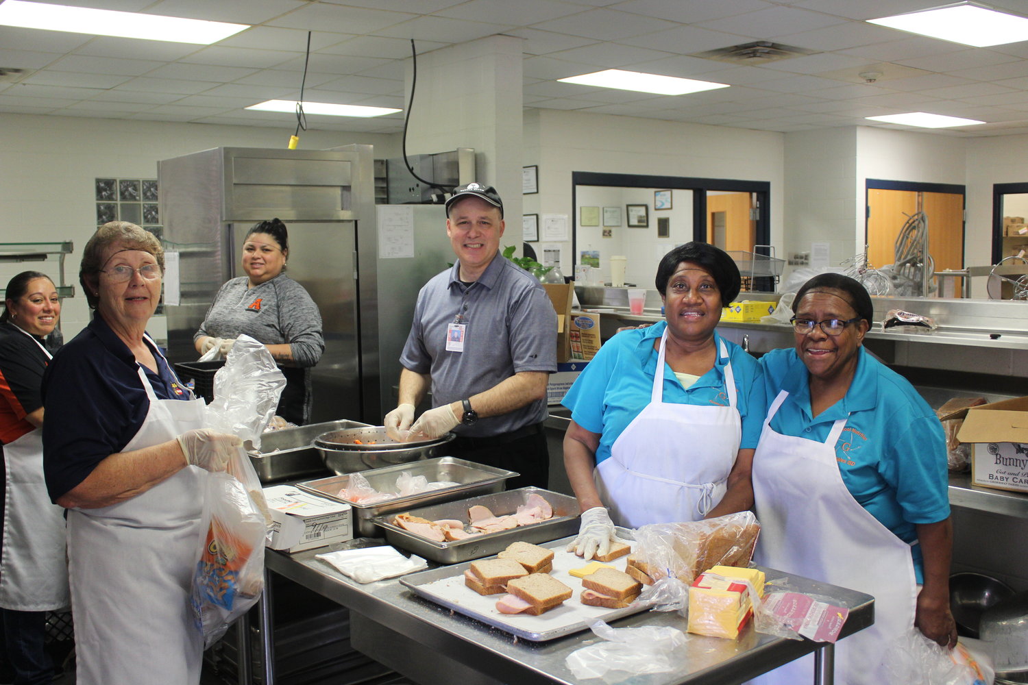 Local school districts (including Gonzales ISD, pictured here) began their curbside meal service this week, providing free breakfast and lunch meals for all children 18 years and younger.