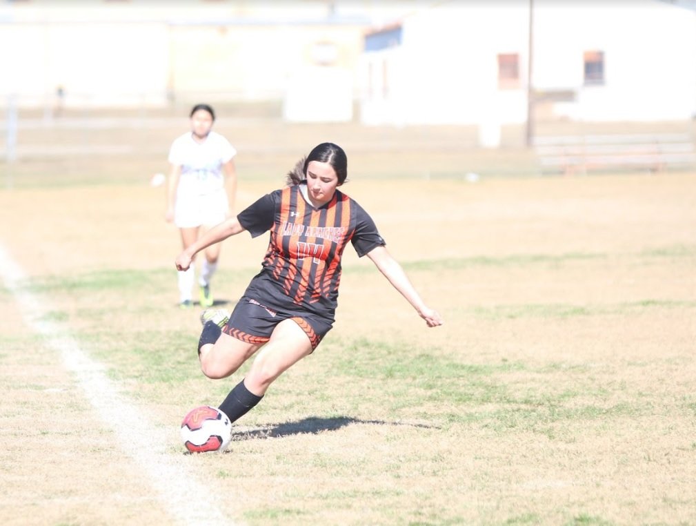 Stephanie Gonzales (14) was one of three Lady Apaches who were named to the District 29-4A first-team all-district. Sandra Palacios and Veronica Moreno were also awarded. 
