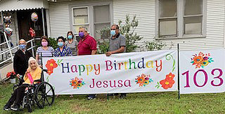 Family and friends help Maria De Jesus “Jesusa” Almaraz celebrate her 103rd birthday.