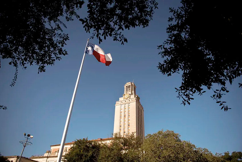 The Texas flag flies on the south lawn of the University of Texas at Austin campus.
