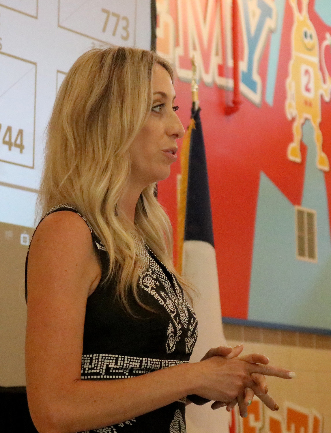 East Avenue Primary Principal Brandi Bell discusses school reconfiguration with the school board Monday evening.