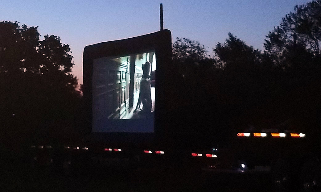 The movie “Call of the Wild” is shown on the big screen during a drive-in movie night in Smiley.