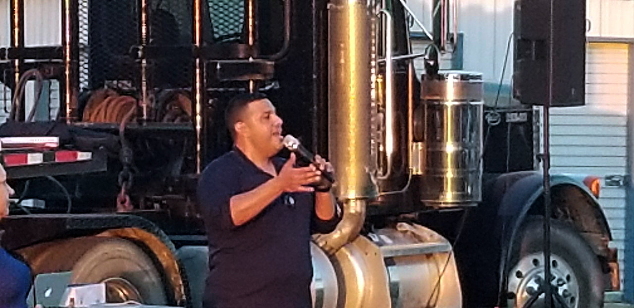 Jason Montoya, senior pastor with Nations Christian Fellowship Church, welcomes the crowd to the drive-in movie night Friday in Smiley.