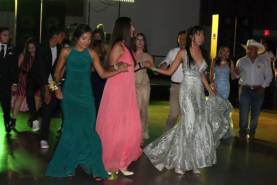 Dancing together are Stephanie Reyna, Julienne Morales, and Anabela Rodriguez.
